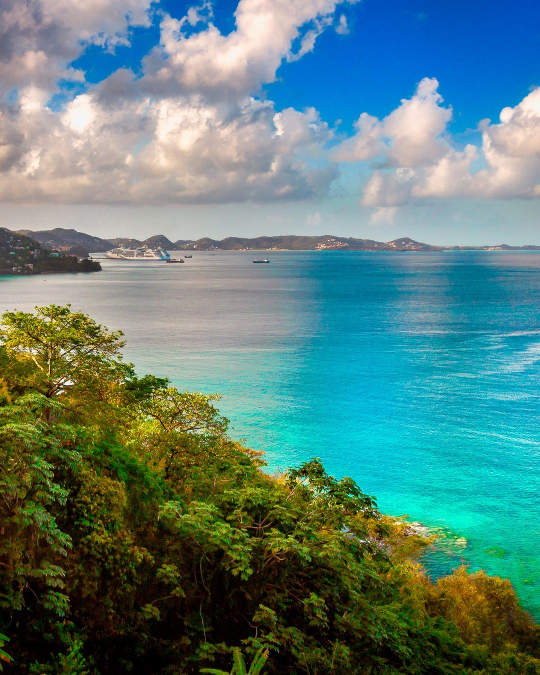 Turquoise water and a jungle headland on a Caribbean coastline